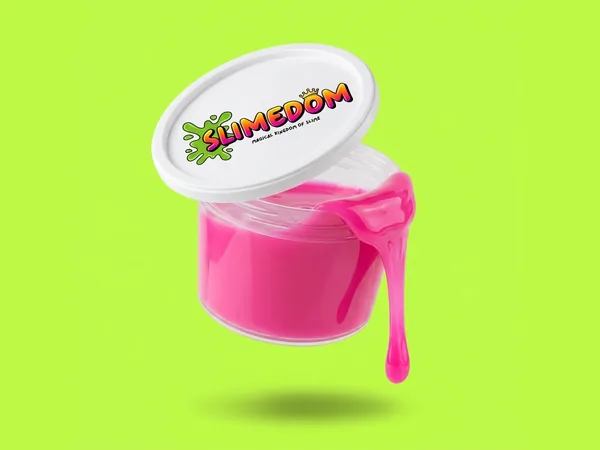 A single tub of pink slime floating on lime green, the lid tipped open and a drip hanging off the rim.